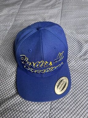 Gorra Snapback Yupoong "Hustle All Directions" - Azul Real y Amarillo.